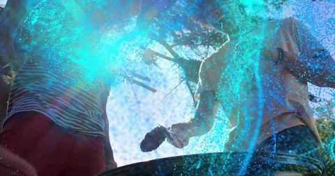 Two men adding compost to barrel while working together in sunlit backyard with blue overlay