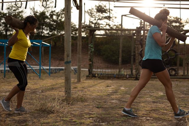 Women Carrying Logs During Outdoor Boot Camp Training - Download Free Stock Images Pikwizard.com