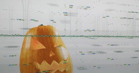 Glitched Jack-O'-Lantern on Desk Featuring Digital Glitch Art for Halloween Tech Design