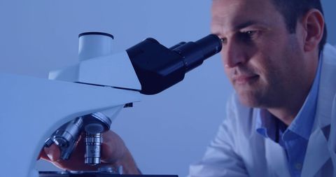Scientist Analyzing Samples through Microscope in Laboratory - Download Free Stock Images Pikwizard.com
