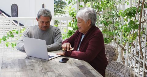Senior Couple Enjoying Technology on Patio - Download Free Stock Images Pikwizard.com