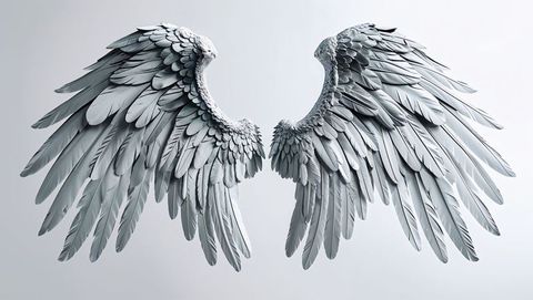 Majestic sculpted feathered angel wings in studio lighting