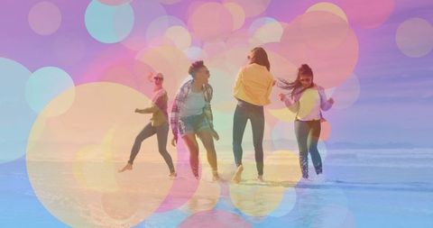 Friends Dancing Joyfully at Vibrant Beach Shoreline