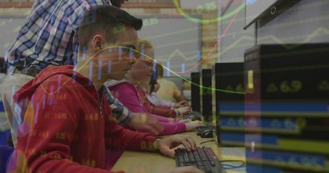 Students learning data analytics and stock trading concepts in computer lab with mentor