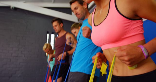 Family and Friends Practicing Resistance Band Exercises in Gym - Download Free Stock Images Pikwizard.com