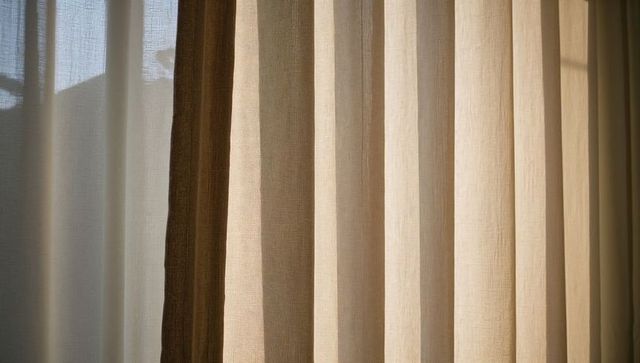 Sunlit Sheer Linen Curtains Casting Soft Pleats and Vertical Light Stripes