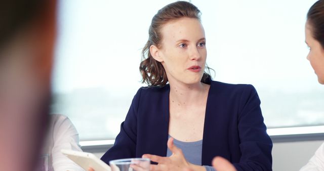 Businesswoman Discussing Strategy During Office Meeting - Download Free Stock Images Pikwizard.com