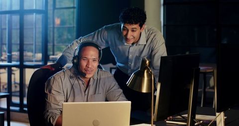 Business Colleagues Collaborating on Late-Night Office Project