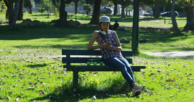 Young Woman Relaxing in Park on Sunny Day - Download Free Stock Images Pikwizard.com