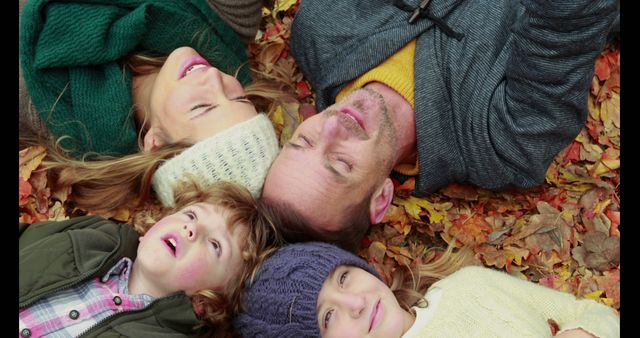 Family Lying on Autumn Leaves Enjoying Fall Season Outdoors - Download Free Stock Images Pikwizard.com