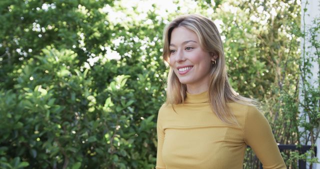 Smiling Woman in Yellow Top Enjoying Sunny Garden - Download Free Stock Images Pikwizard.com