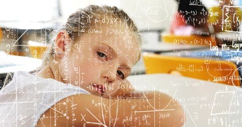 Young student resting at desk with math formulas overlay conveying thoughtful learning
