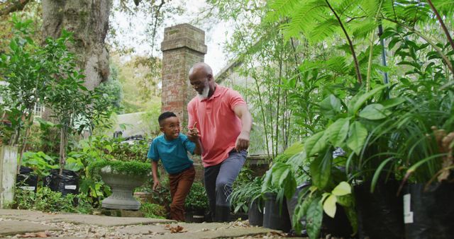 Father and Son Exploring Garden Center with Lush Greenery - Download Free Stock Images Pikwizard.com