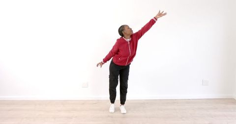 Person Performing Graceful Stretch in Minimalist Interior - Download Free Stock Images Pikwizard.com