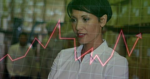 Female Warehouse Worker Analyzing Financial Data Trends