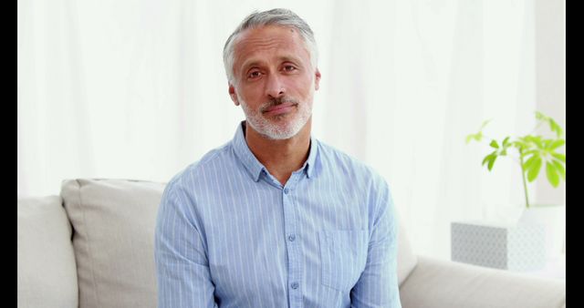 Middle-Aged Man Smiling in Cozy Living Room - Download Free Stock Images Pikwizard.com