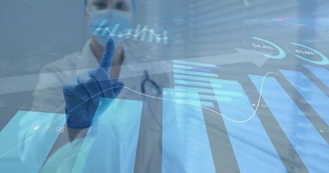 Doctor pointing at holographic medical analytics display with graphs and ar interface in clinic