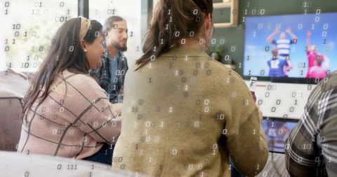 Friends watching tv with binary code overlay illustrating digital streaming and data monitoring