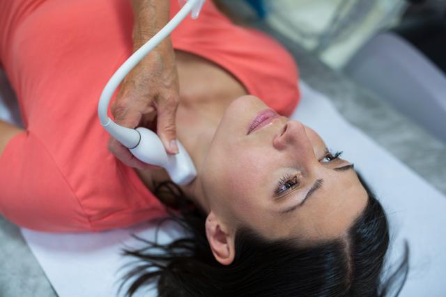 Woman Receiving Thyroid Ultrasound Examination - Download Free Stock Photos Pikwizard.com