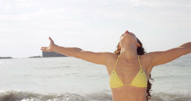 Woman Enjoying Freedom at Beach With Open Arms - Download Free Stock Images Pikwizard.com