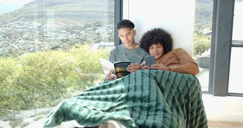 Friends Reading and Relaxing by Bright Window View