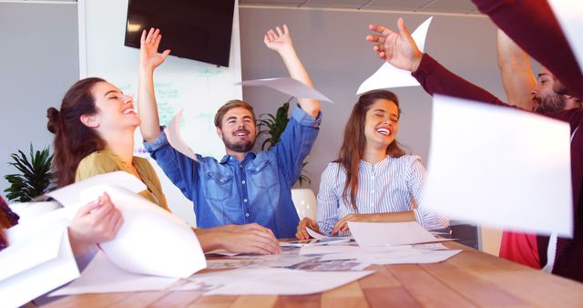 Team Celebrating Office Victory with Paper Flying - Download Free Stock Images Pikwizard.com