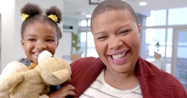 Happy Mother and Daughter Smiling in Bright Indoor Setting - Download Free Stock Images Pikwizard.com