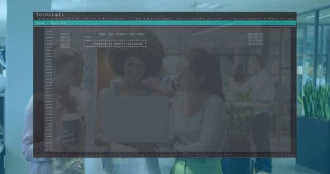 Team collaborating around laptop with terminal overlay in modern casual office workspace
