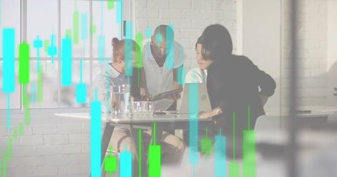 Collaborating team analyzing financial data with candlestick overlay during office meeting