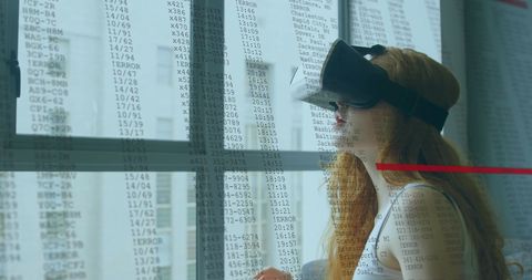 Woman Engaged with Virtual Reality and Data Interface - Download Free Stock Images Pikwizard.com