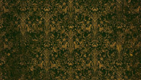 Vintage damask wallpaper metallic gold filigree on deep green parlor wall texture