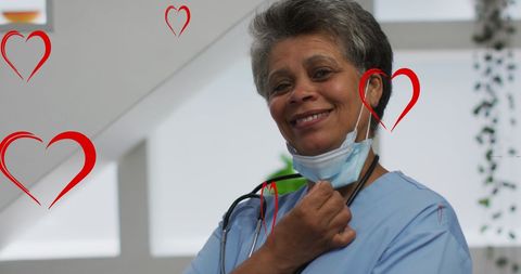 Smiling African American Female Doctor with Heart Icons