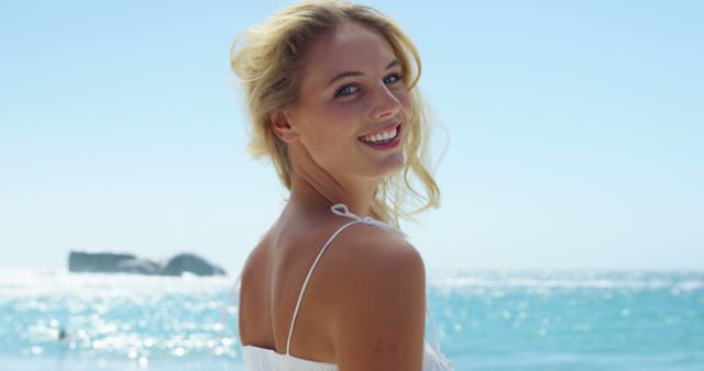 Cheerful Woman Enjoying Sunny Day at Beach - Download Free Stock Images Pikwizard.com