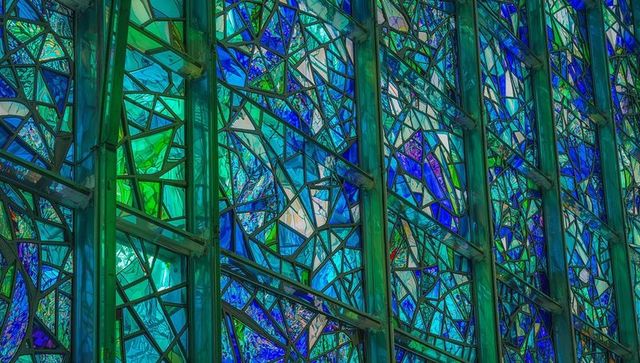 Colorful stained glass panels illuminating chapel
