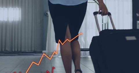 Businesswoman walking through hotel lobby pulling suitcase with rising graph overlay