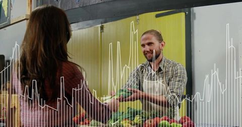 Vendor presenting fresh produce at farmers market
