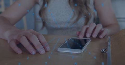 Resting female hands near smartphone displaying blue augmented reality data overlay