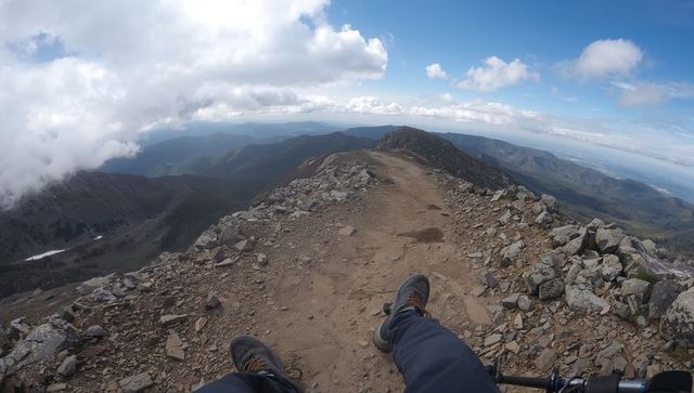 Hiking Adventure on Rocky Mountain Ridge with Breathtaking Views