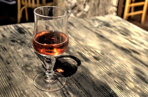 Glass of Rose Wine on Rustic Wooden Table