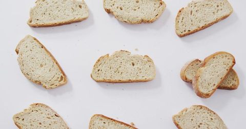 Assorted bread slices on white surface for culinary design