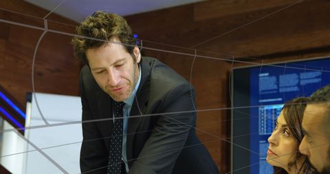 Businessman Leading Edge Technology Discussion with Team - Download Free Stock Images Pikwizard.com