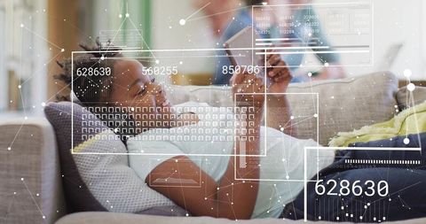 Young Girl Relaxing on Sofa with Smartphone and Earbuds
