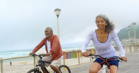 Active senior african american couple enjoying bike ride