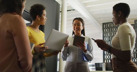 diverse businesswomen in office using technology and collaborating - Download Free Stock Images Pikwizard.com