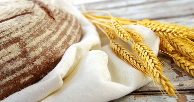Freshly Baked Bread with Wheat Stalks and Linen Cloth - Download Free Stock Images Pikwizard.com