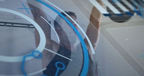 Athlete lifting medicine ball overhead with futuristic hud overlay in gym