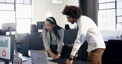 Multinational Colleagues Collaborating in Modern Office Environment