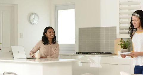 Mother and Daughter Bonding in Bright Modern Kitchen