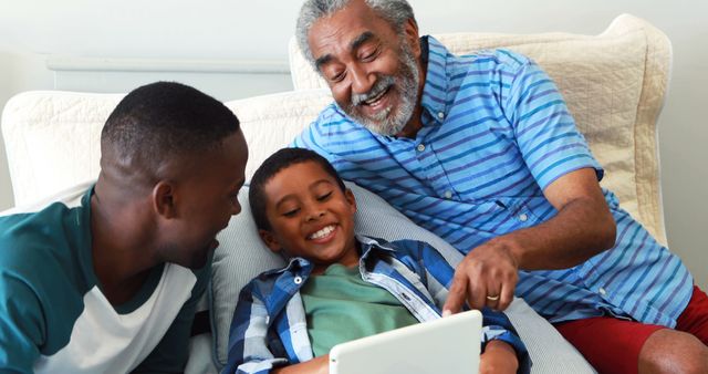 Grandfather and Grandchildren Enjoying Tablet Together on Couch - Download Free Stock Images Pikwizard.com