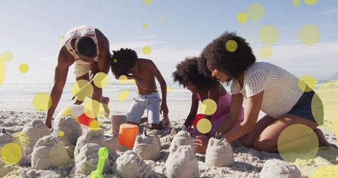 Family Enjoying Sandcastle Building on Sunny Beach Day